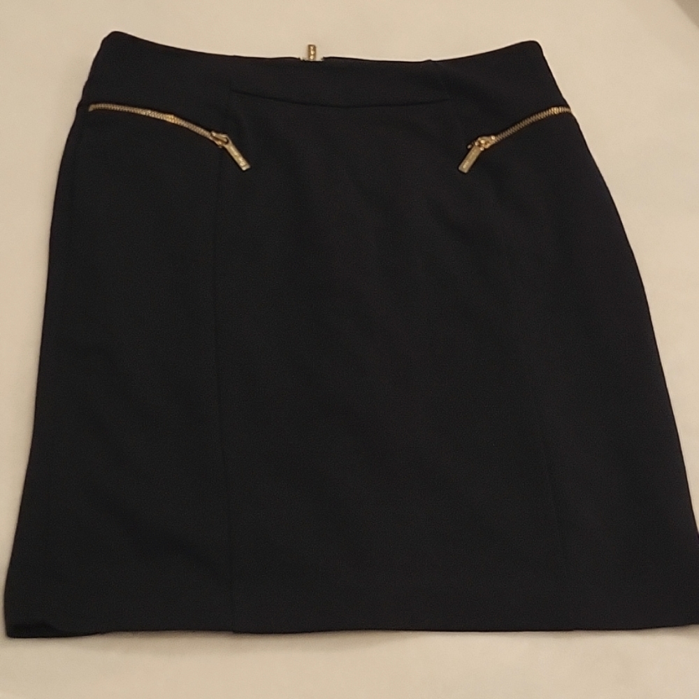 Knee length Michael kors size 10 skirt. Navy/gold zippers. Used.